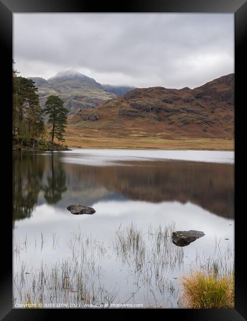 Calm afternoon at Blea Tarn Framed Print by JUDI LION