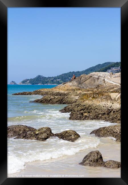 Man sat on rocks  Framed Print by Kevin Hellon