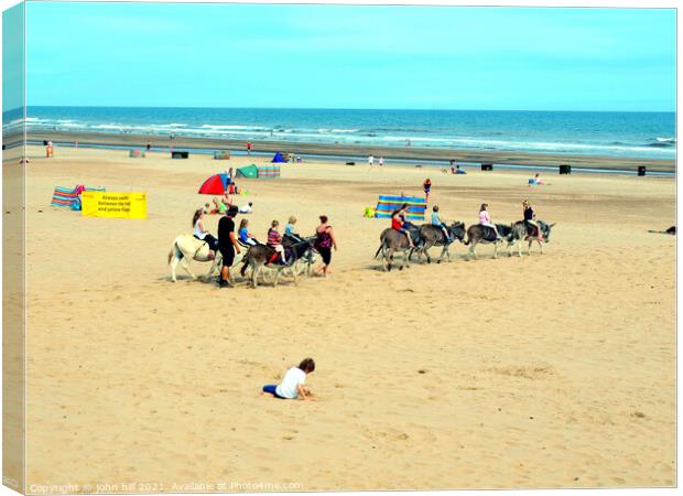 Donkey rides on Mablethorpe beach. Canvas Print by john hill