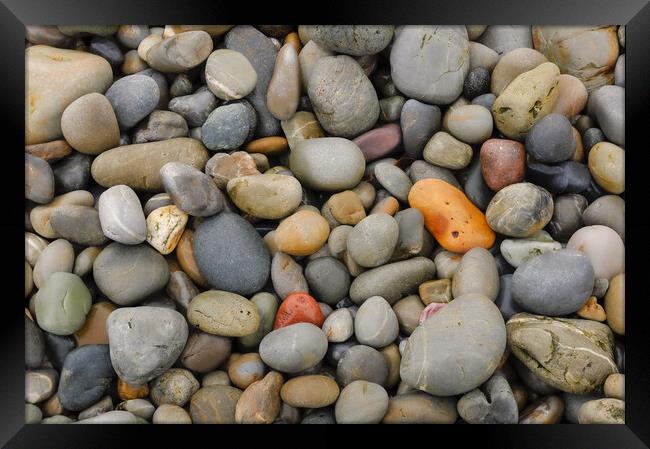 Smooth beach pebbles Framed Print by Andrew Kearton