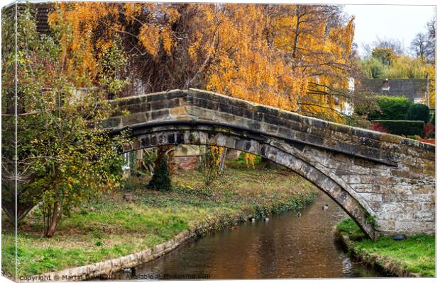 The Old Packhorse bridge over The River Leven, Stokesley Canvas Print by Martin Davis