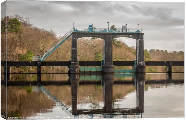 Flood gates reflecting on Earlstoun Loch at Earlstound Dam Canvas Print by SnapT Photography
