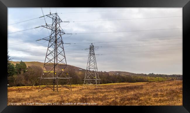 Electricity pylons in a field on a cloudy day in winter at Kendoon Power Station Framed Print by SnapT Photography