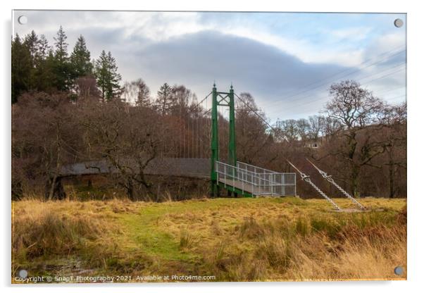 A green wooden suspension bridge on a trail leading into a forest woodland Acrylic by SnapT Photography