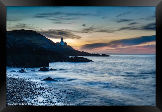 Mumbles lighthouse viewed from Bracelet bay Framed Print by Bryn Morgan