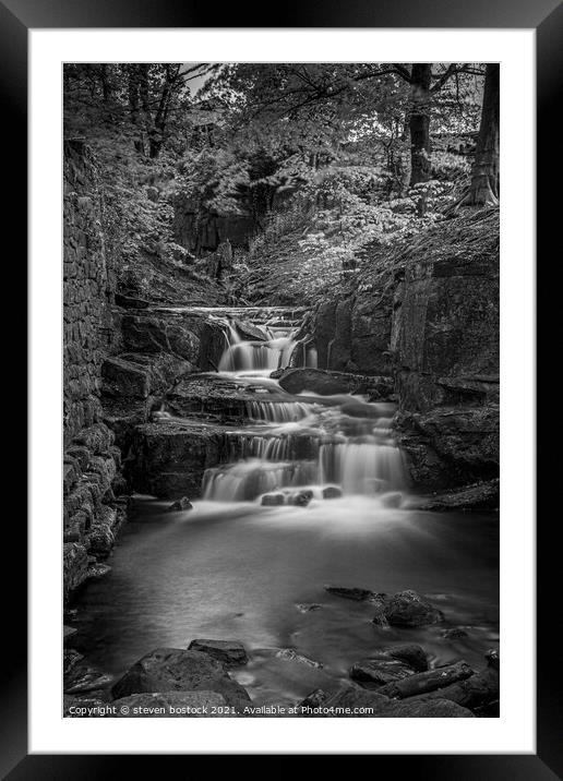 A  waterfall in a forest Framed Mounted Print by steven bostock