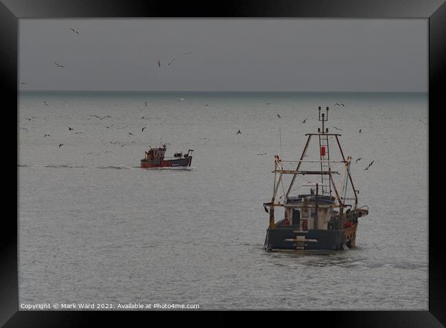 The Hastings Fishing Boats at work. Framed Print by Mark Ward