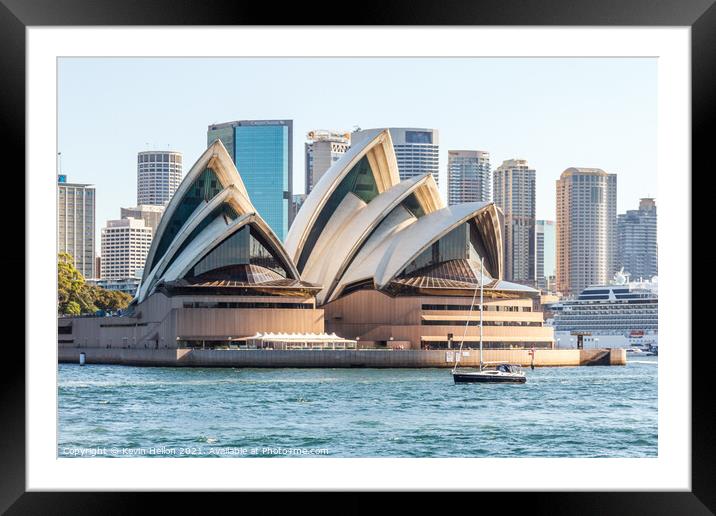 A yacht cruises by the Opera House Framed Mounted Print by Kevin Hellon