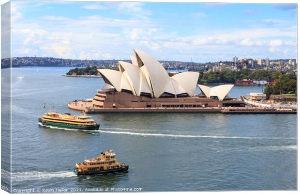 Ferries passing the Sydney Opera House Canvas Print by Kevin Hellon