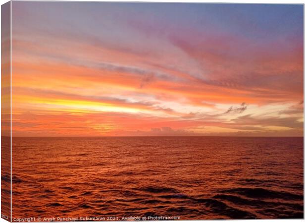 beautiful sunset in ocean and cloudy sky Canvas Print by Anish Punchayil Sukumaran