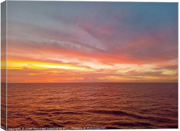 beautiful sunset in ocean and cloudy sky Canvas Print by Anish Punchayil Sukumaran