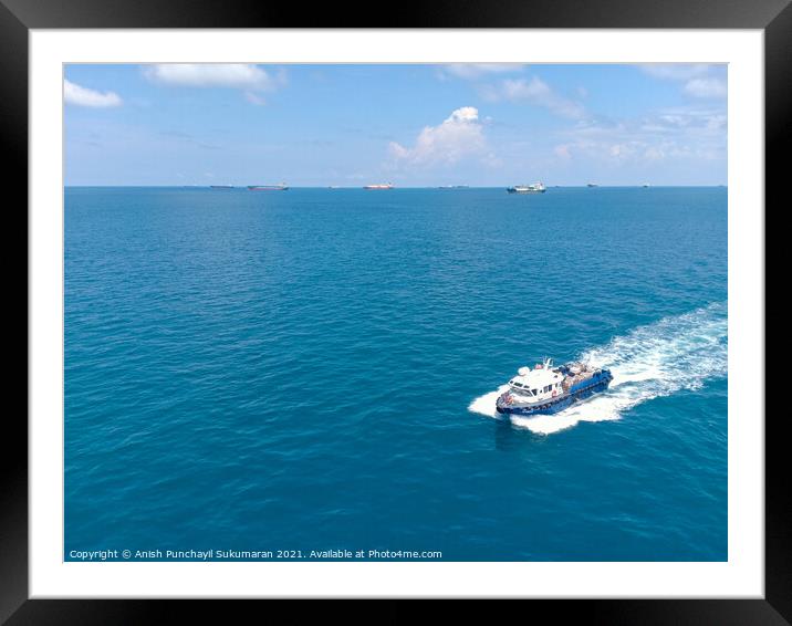 a boat delivering food supplies Framed Mounted Print by Anish Punchayil Sukumaran