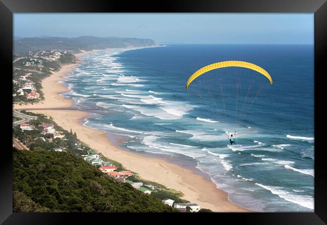 Parasailing over Wilderness Beach, South Africa Framed Print by Neil Overy