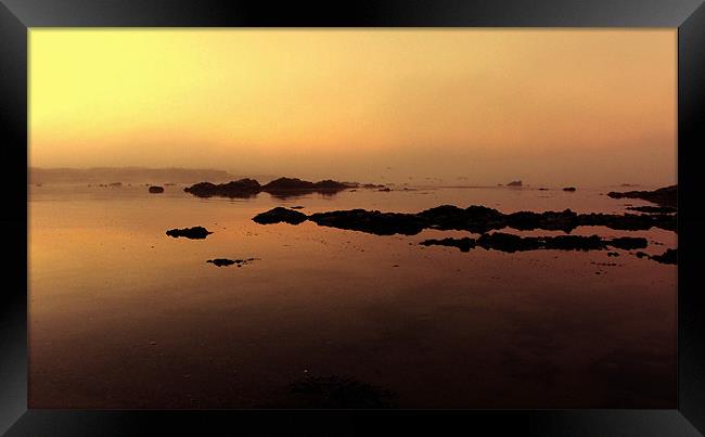 Misty Calm at Cwyfan Bay Framed Print by Ian Tomkinson