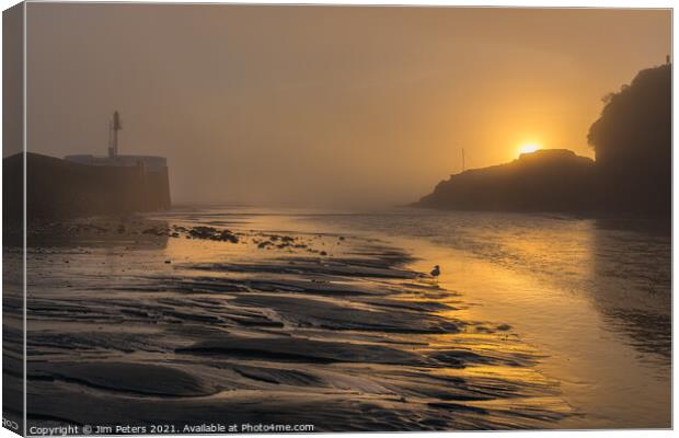 Misty sunrise over white path rock Looe Harbour Canvas Print by Jim Peters