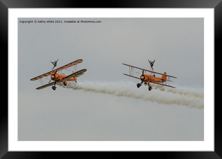 walking on the wing of a plane side by side Framed Mounted Print by kathy white