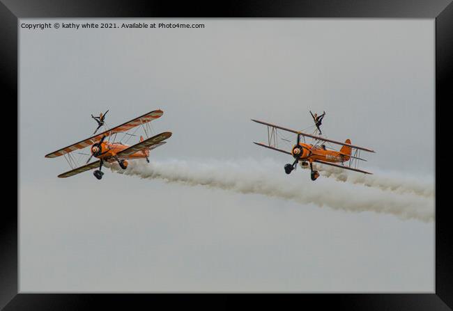 walking on the wing of a plane side by side Framed Print by kathy white