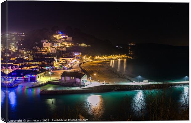 Looe beach and pier at night Canvas Print by Jim Peters