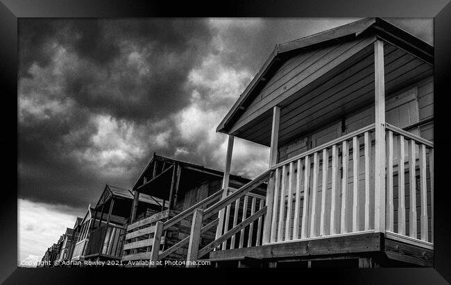 Whitstable Beach Huts in Monochrome Framed Print by Adrian Rowley