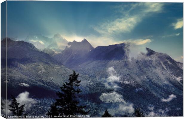 Misty Rocky Mountains  Canvas Print by Elaine Manley