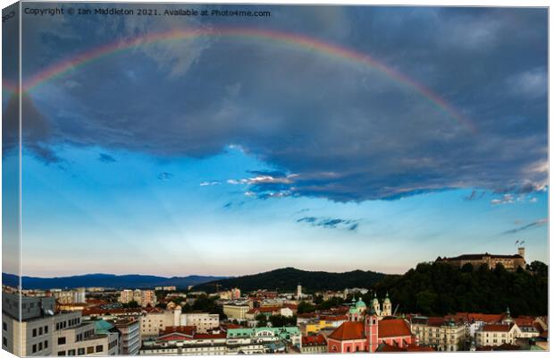 Rainbow over Ljubljana Canvas Print by Ian Middleton