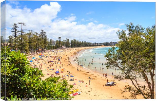 People sunbathing and enjoying Manly beach Canvas Print by Kevin Hellon