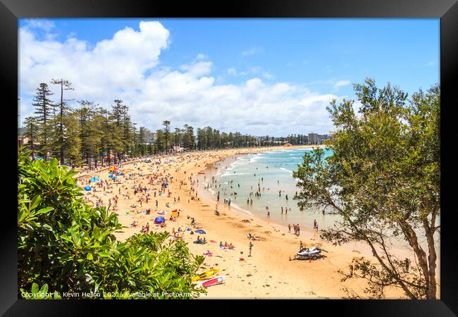 People sunbathing and enjoying Manly beach Framed Print by Kevin Hellon