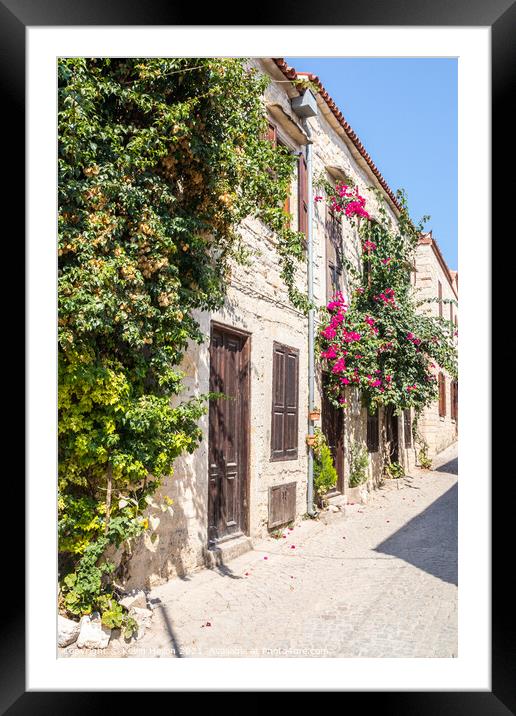 Stone houses covered with bougainvillaea, Framed Mounted Print by Kevin Hellon