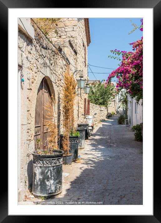 Narrow street with stone houses Framed Mounted Print by Kevin Hellon