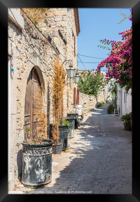 Narrow street with stone houses Framed Print by Kevin Hellon