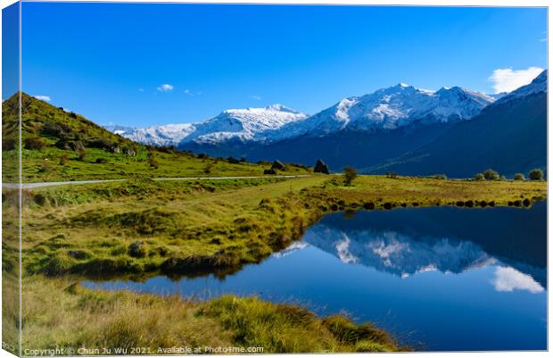 Snow mountains and reflection on lake in South Island, New Zealand Canvas Print by Chun Ju Wu