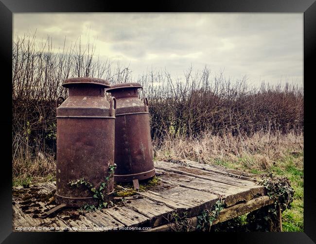 Rusted Vintage Milk Churns On A Wooden Platform Framed Print by Peter Greenway