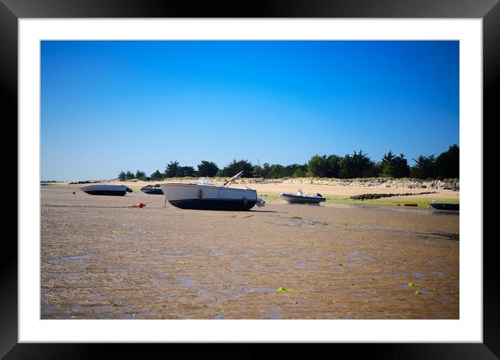 boats laying on the sand at lowtide Framed Mounted Print by youri Mahieu
