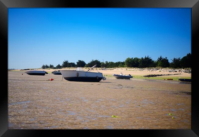 boats laying on the sand at lowtide Framed Print by youri Mahieu