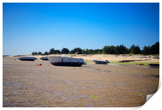 boats laying on the sand at lowtide Print by youri Mahieu