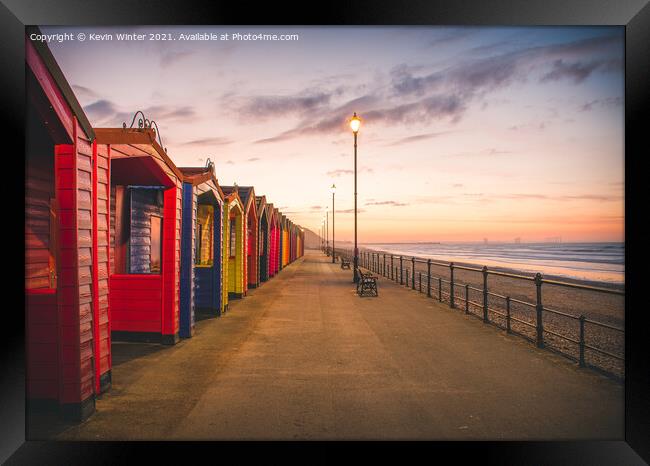 Beach Huts at sunset Framed Print by Kevin Winter