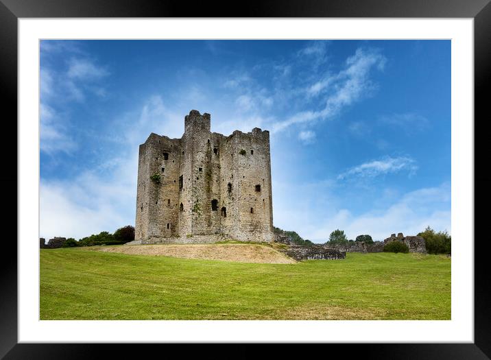 Ancient mediaeval castle in Ireland surrounded by grassy fields  Framed Mounted Print by Thomas Baker