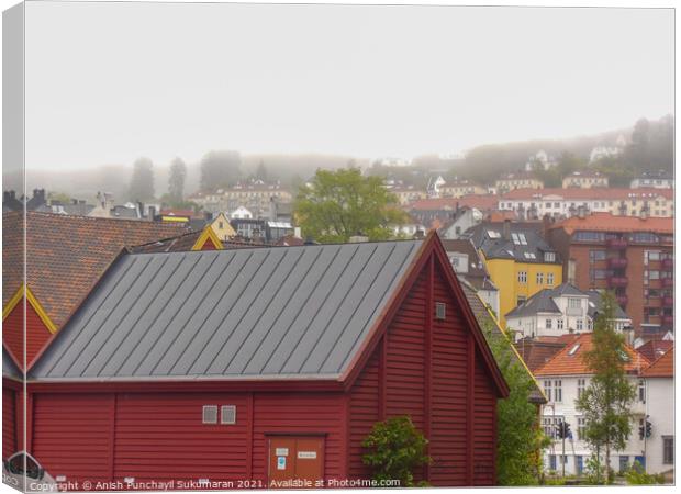 beautiful norwegian village covered with fog during day time Canvas Print by Anish Punchayil Sukumaran