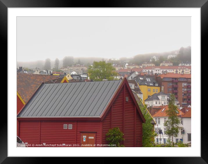 beautiful norwegian village covered with fog during day time Framed Mounted Print by Anish Punchayil Sukumaran