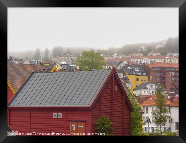 beautiful norwegian village covered with fog during day time Framed Print by Anish Punchayil Sukumaran