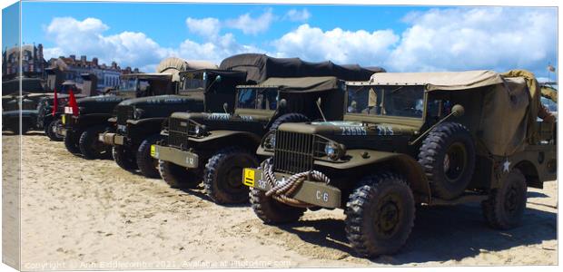 Military trucks and jeeps on Weymouth beach Canvas Print by Ann Biddlecombe