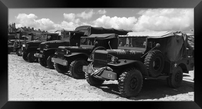 Military trucks and jeeps on Weymouth beach in mon Framed Print by Ann Biddlecombe