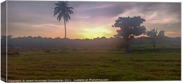  orange Sunset in Kerala, cloudy sky and coconut tree Canvas Print by Anish Punchayil Sukumaran