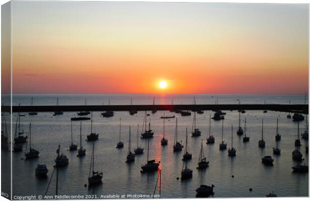 Sunrise over the outer harbor in Brixham  Canvas Print by Ann Biddlecombe