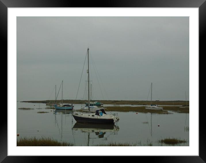 A Yacht reflecting in the water in Old Leigh in the Thames Estuary Framed Mounted Print by John Bridge