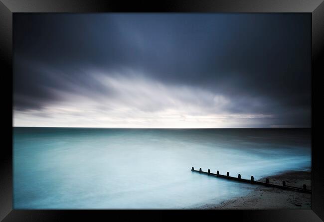 Groynes and sea, Worthing, Sussex Framed Print by Neil Overy