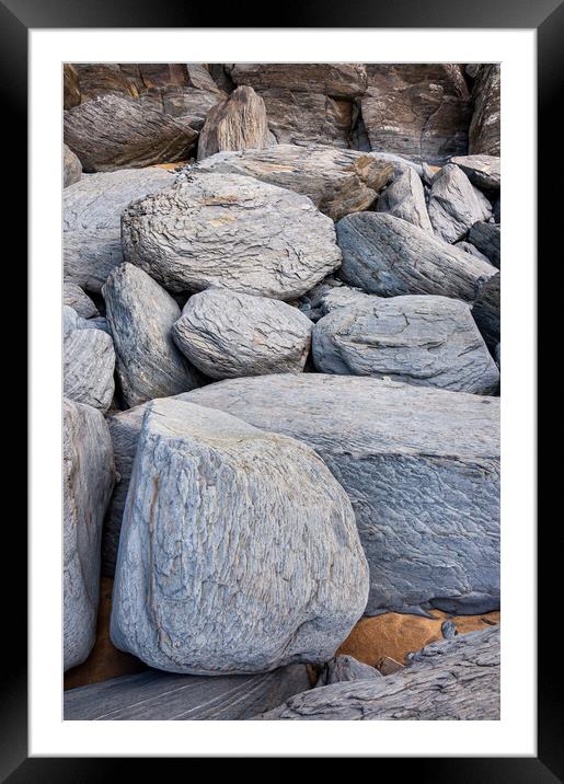 Sea worn boulders ob Penbryn Beach, Wales Framed Mounted Print by Andrew Kearton