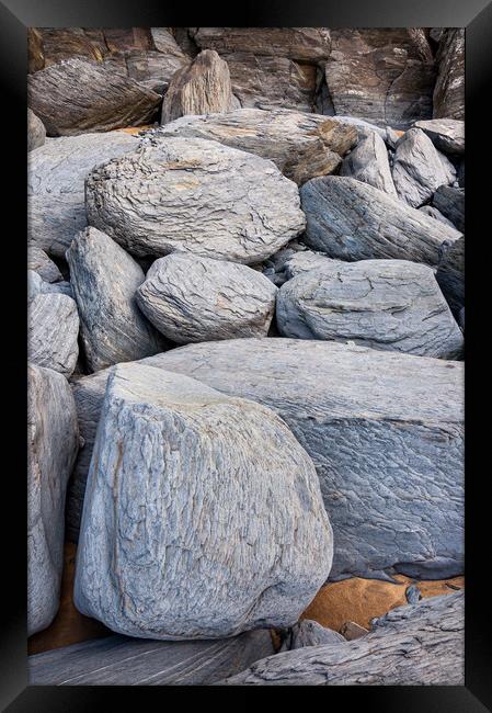 Sea worn boulders ob Penbryn Beach, Wales Framed Print by Andrew Kearton