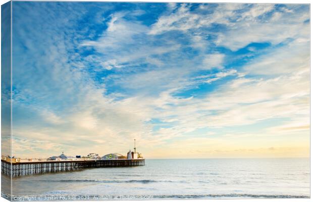 Brighton pier at sunset Canvas Print by Justin Foulkes