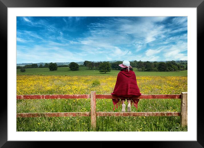Woman sitting on fence while looking out at the farmland   Framed Mounted Print by Thomas Baker
